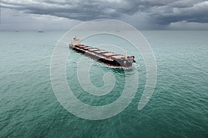 Impressive aerial view of a giant freighter crossing the ocean