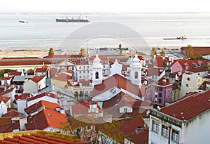 Alfama Neighborhood on Tagus Riverbank as Seen from Portas do Sol View Point, Lisbon, Portugal photo