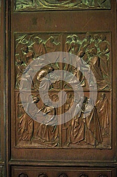 Detail of the Central Bronze Door of the Duomo of Siena, Tuscany - Italy photo