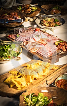 Impressive buffet woodentable in a wedding hall with meat, cheese, and traditional Czech food lard fat, pig, Czech Republic, Europ