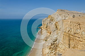 Impressive cliffs with turquoise ocean at the coast at Caotinha, Angola