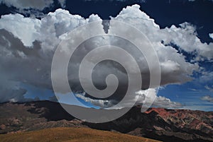 impressive cloud and colorful rock formations at hornocal