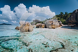 Impressive cloudscape above Anse Source D& x27;Argent tropical beach, La Digue Seychelles. Luxury exotic travel concept