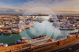 The impressive entrance to the historic Royal Harbour of Ramsgate, Kent, Uk, full of leisure and fishing boats of all sizes