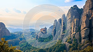 Impressive landscape of sandstone, rock formation and monastery at sunset photo
