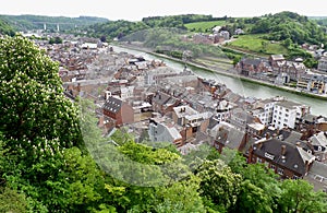 Impressive rooftop view of the vintage buildings along Meuse river, Dinant, Belgium