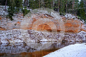 Impressive sandstone wall on the banks of the river Salaca, Skanaiskalns national park, Latvia photo