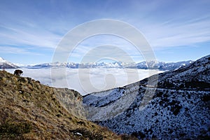 Impressive snow-capped mountains with spectacular views of the sea of clouds Queenstown NZ
