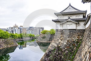 The impressive stone wall of Osaka castle, Japan photo