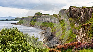 Impressive vertical-walled cliffs on the Scottish island of Skye, UK.