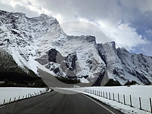 Impressive winter mountain landscape with Scandinavian mountain range. Road trip in northern Norway