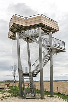 Impressive wooden and metal tower from the watchtower Mesch in the middle of a countryside