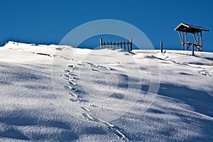 Imprints footsteps in the snow a day of blue sky