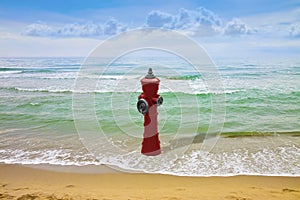 An improbable hydrant at the seaside - Plenty of water illogical concept image