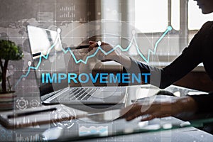 Improvement graph on virtual screen. Business and technology concept.