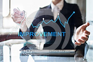 Improvement graph on virtual screen. Business and technology concept.