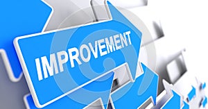 Improvement - Text on Blue Arrow. 3D.