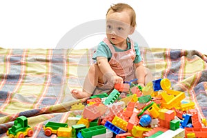 Improving his early skills. Cute boy child building bricks. Little baby play construction game. Little child enjoy