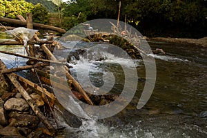 Improvised run-of-stream micro hydro electricity generation. , Laos