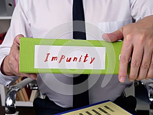 Impunity inscription on the piece of paper