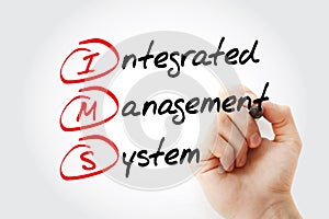 IMS - Integrated Management System acronym with marker, business concept background photo