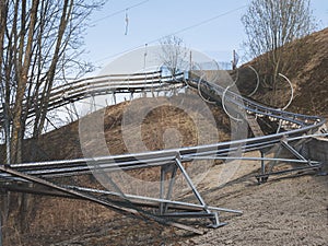 Inactive sports equipment. Toboggan and ski lifts in spring