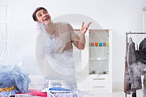 The inattentive husband burning clothing while ironing