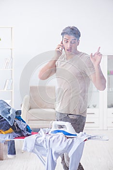 The inattentive husband burning clothing while ironing