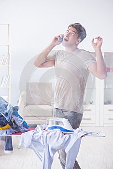 The inattentive husband burning clothing while ironing