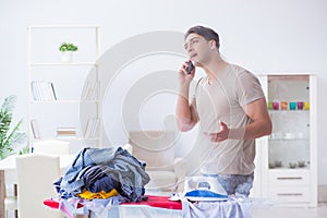 The inattentive husband burning clothing while ironing