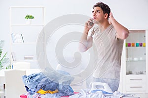 The inattentive husband burning clothing while ironing