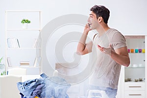 The inattentive husband burning clothing while ironing