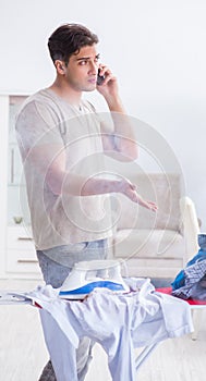 Inattentive husband burning clothing while ironing