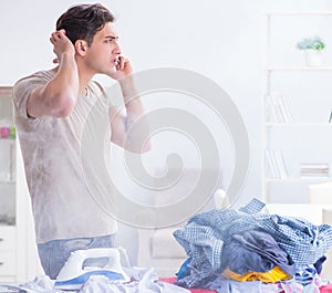 The inattentive husband burning clothing while ironing