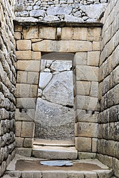 Inca door at Machu Picchu, the sacred city of Incas, Peru