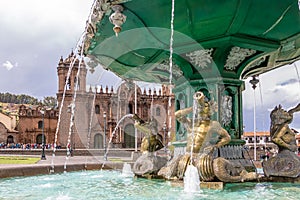 Inca Fountain and Cathedral at Plaza de Armas - Cusco, Peru