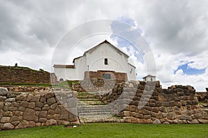 Inca ruins and church in the village of Chinchero, in Peru photo