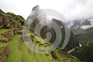 The Inca terraces of Machu Picchu and clouds