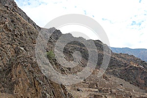 An Incan storage building built into the mountainside at the Ollantaytambo Ruins in the Sacred Valley of Peru