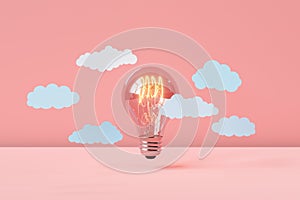 Incandescence lighted bulb with cloud on pink background photo