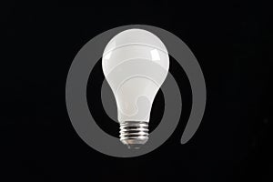 Incandescent light bulb black background
