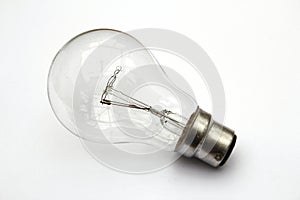 Incandescent tungsten clear light bulb on white