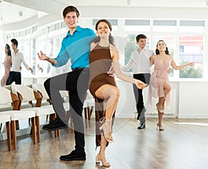 Incendiary swing dance performed by young people in dance studio