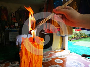 Incense, Big candle and Flame lit by the big candles fire