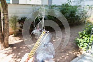Incense burn with smock with food for workship photo