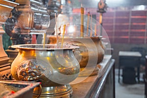 Incense burning in a big bronze cauldron
