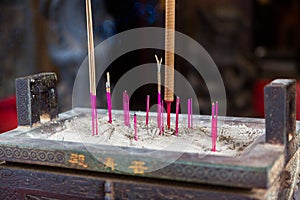 Incense burning Embossed in an incense big stone pot in a buddhistic asian temple in Taiwan
