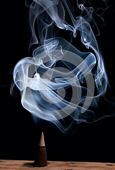 Incense cone with smoke photo