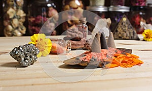 Incense Cones on Stone Slab With Crystals and Flowers