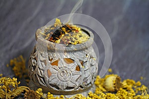 Incense with herbs and tree resins